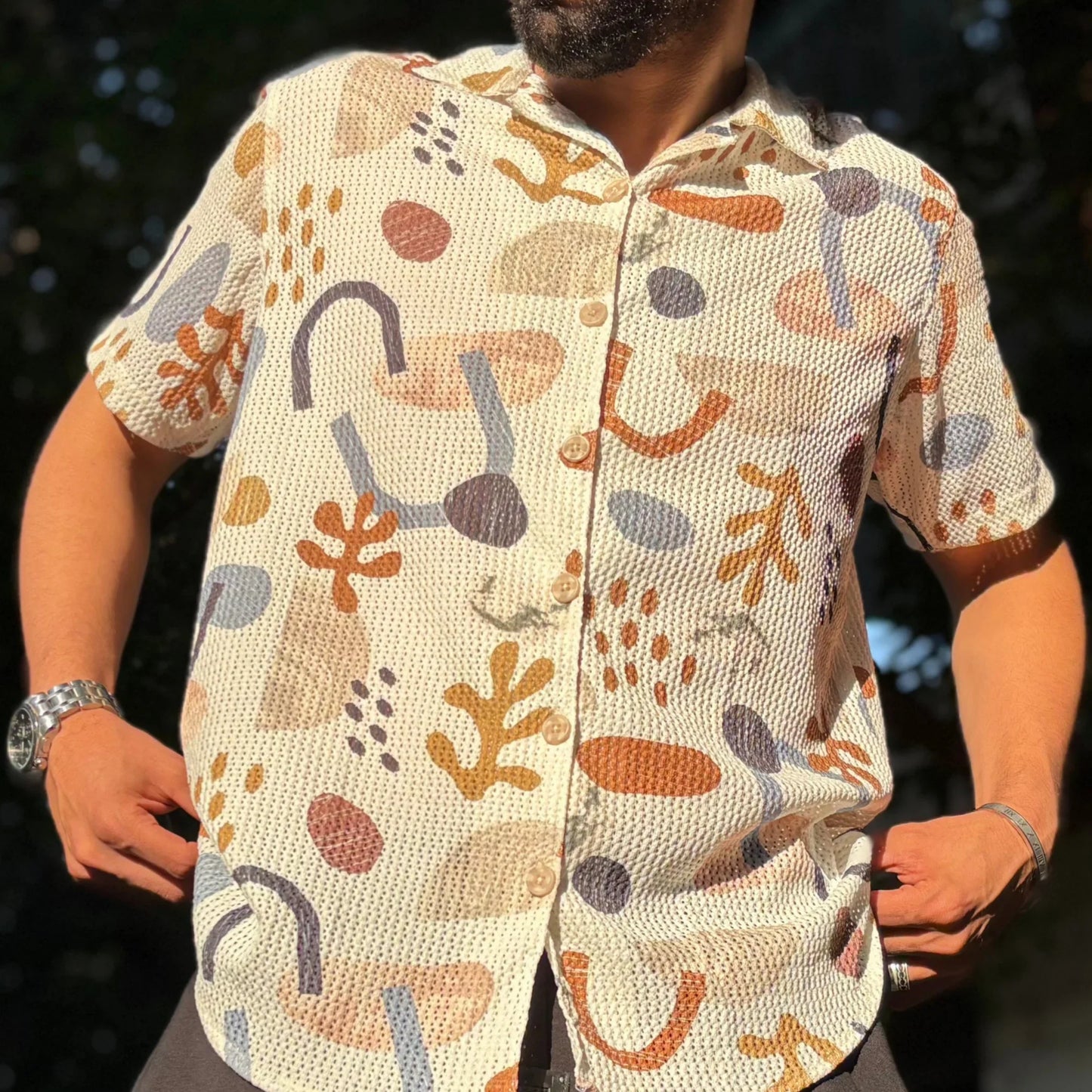 Man wearing retro shirt standing in urban street