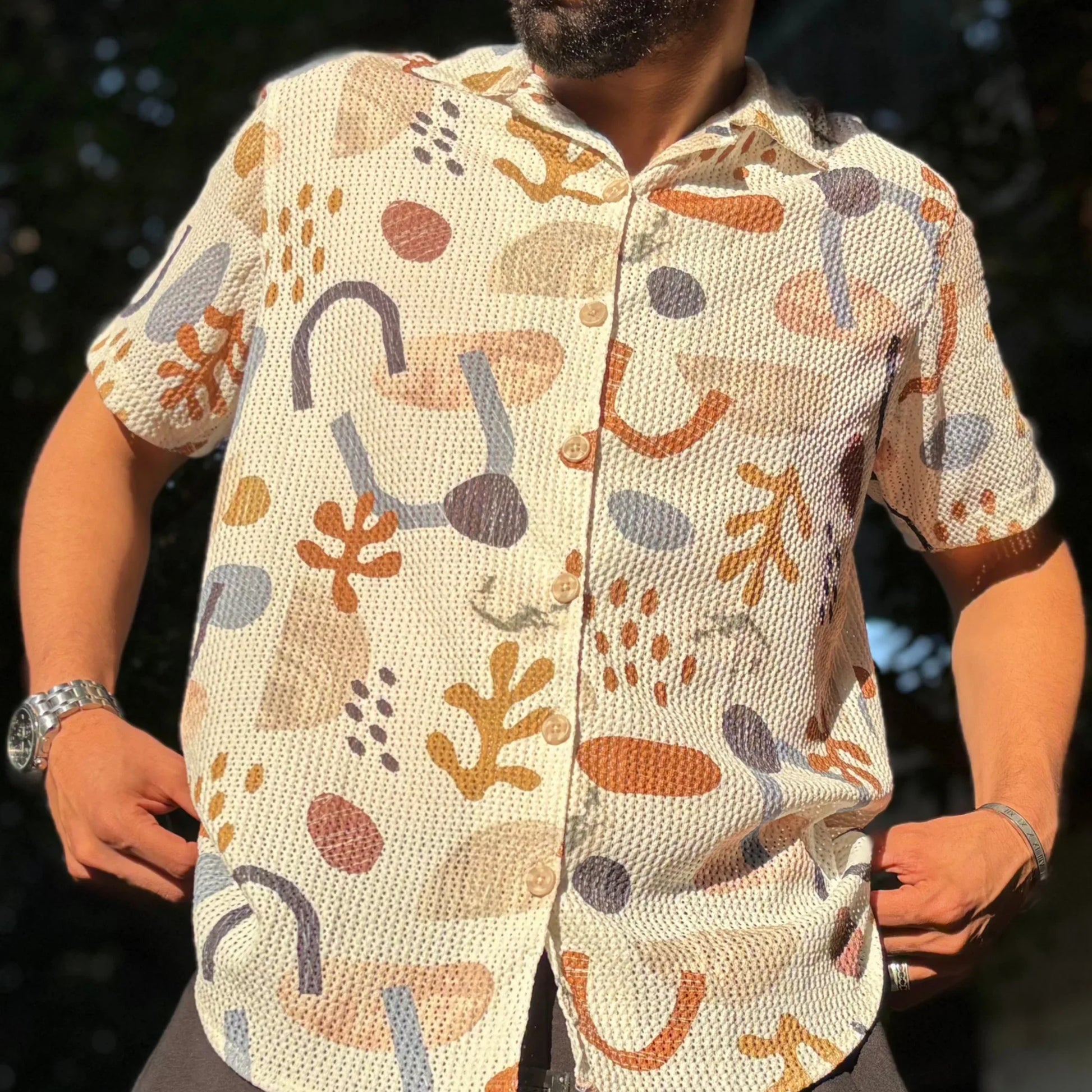Man wearing retro shirt standing in urban street