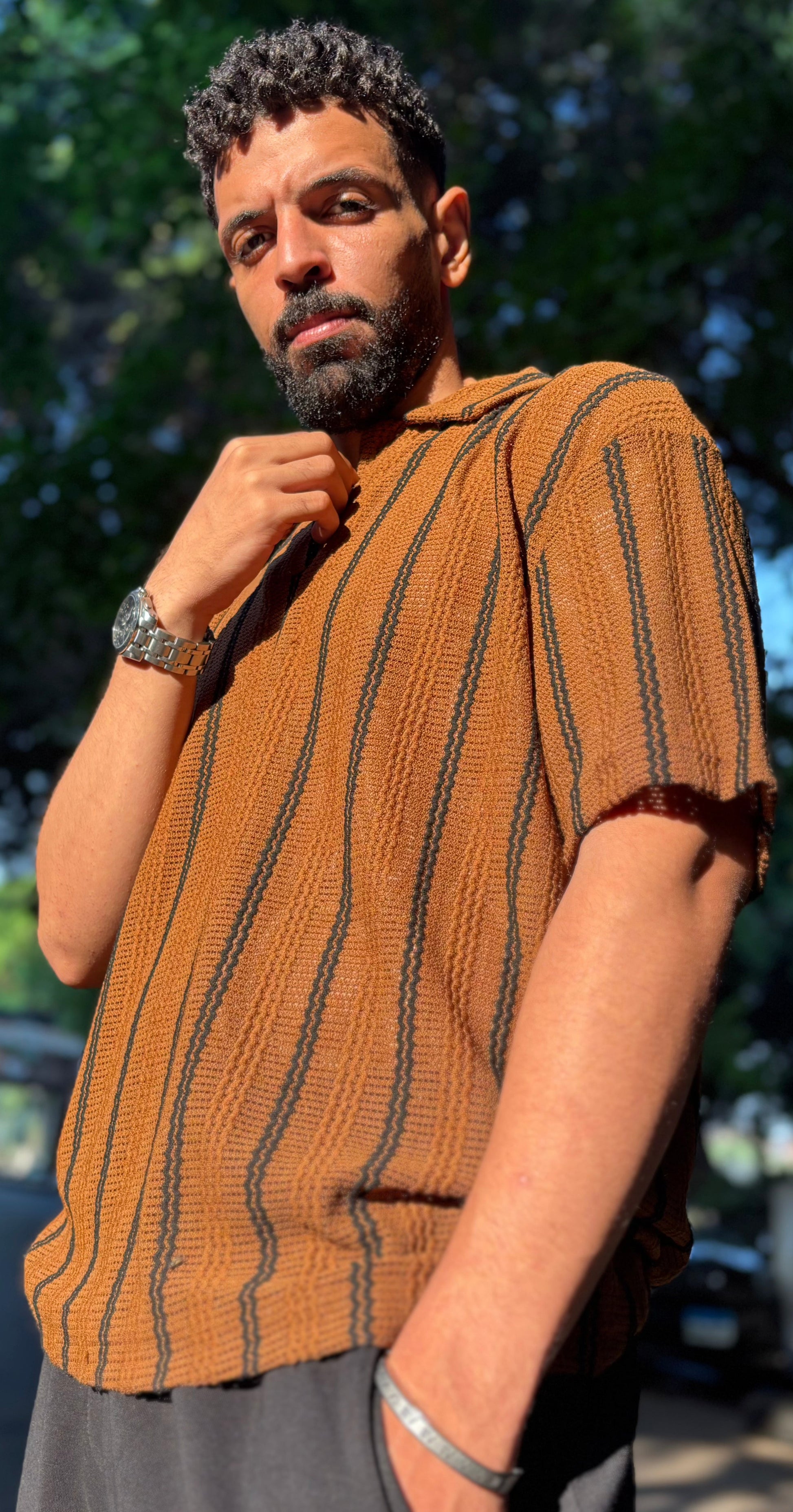 Man wearing classy T-shirt standing in urban street
