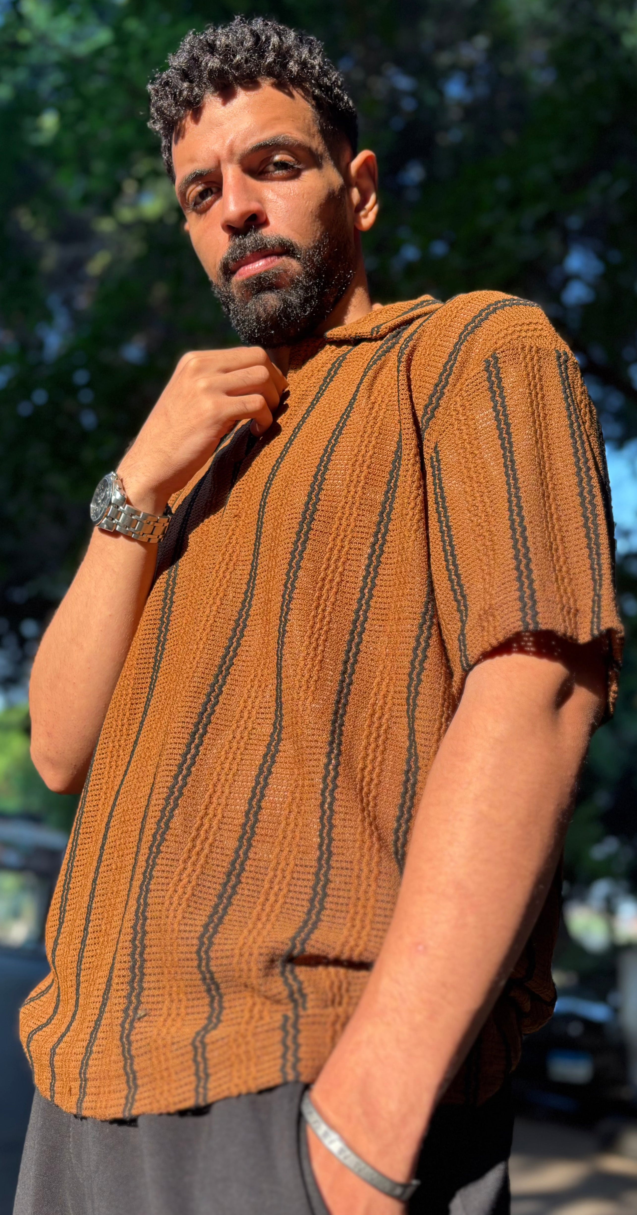 Man wearing classy T-shirt standing in urban street