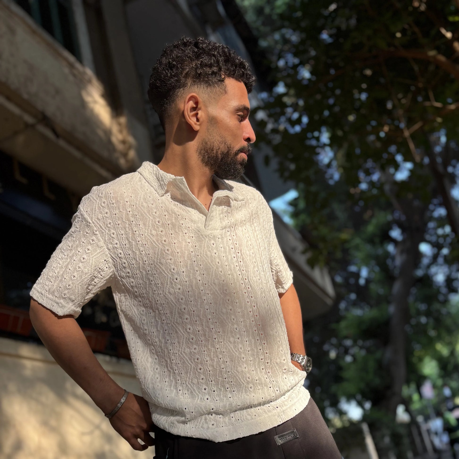Man wearing classy T-shirt standing in urban street